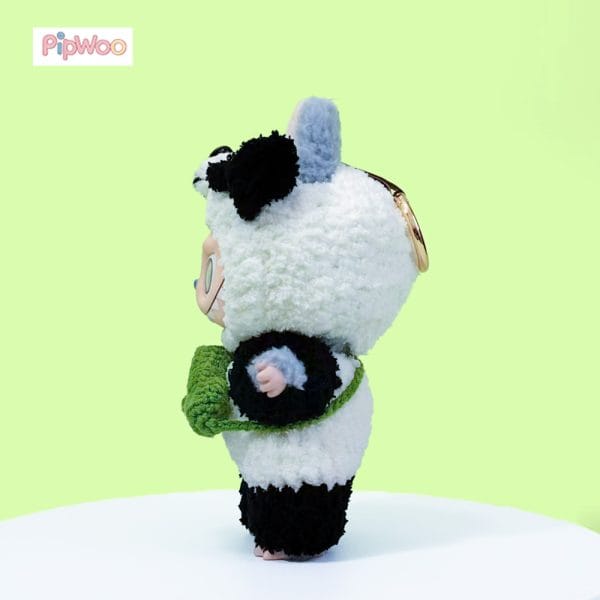 Side view of PipWoo Crochet Panda Outfit for Labubu Dolls, emphasizing the garment's silhouette and texture of the crochet craftsmanship.