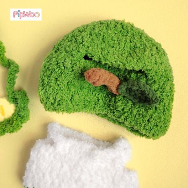 Close-up of Crochet Labubu Clothes - Fresh Apple Fantasy emphasizing fine crochet textures and vibrant green details.