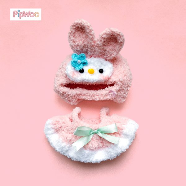 Flat lay of Crochet Labubu Clothes – Bunny Melody displaying hood, dress, and bow accessory together
