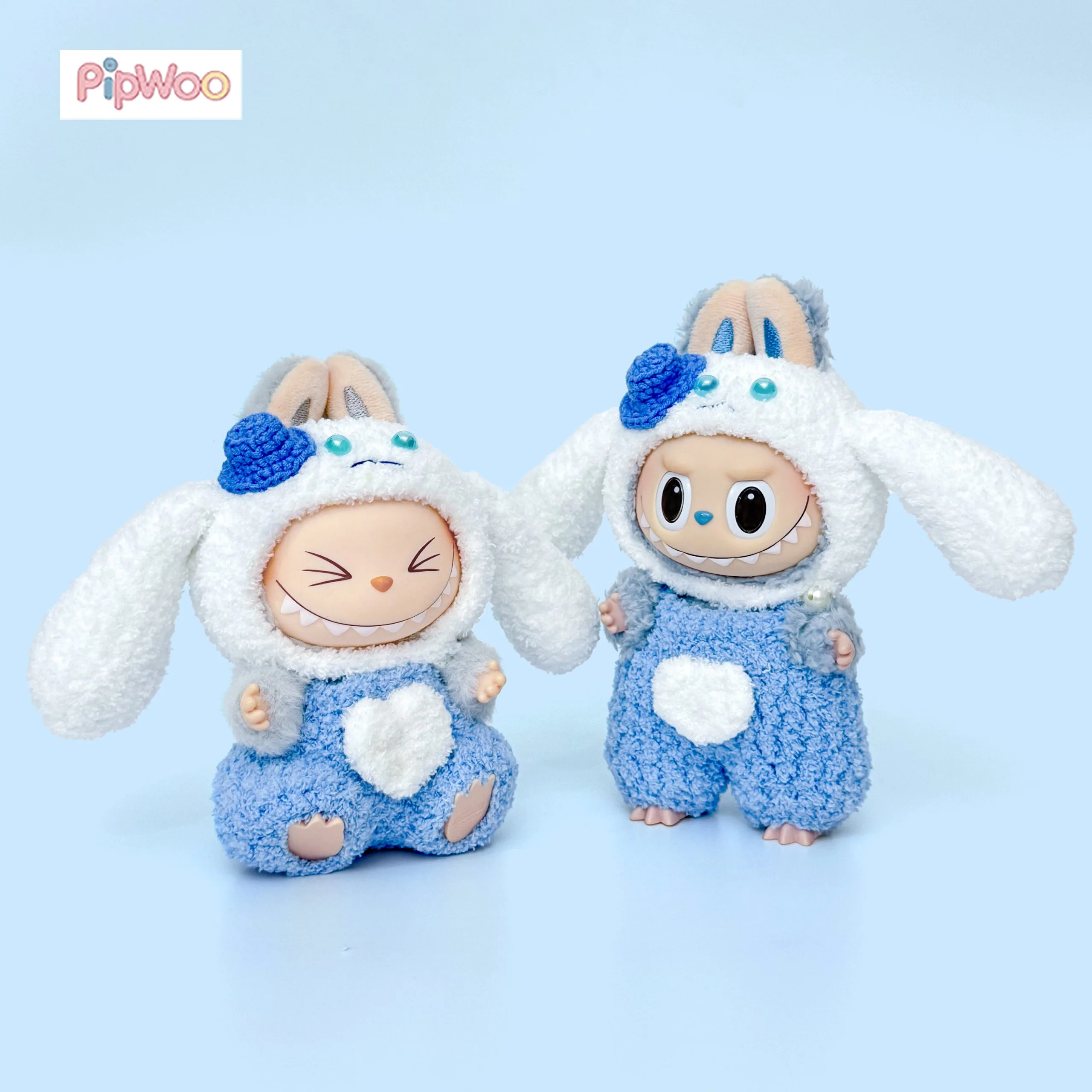 Crochet Labubu Clothes – Cinnamoroll main view showing the floppy‑ear hood with miniature top hat decoration and matching blue onesie