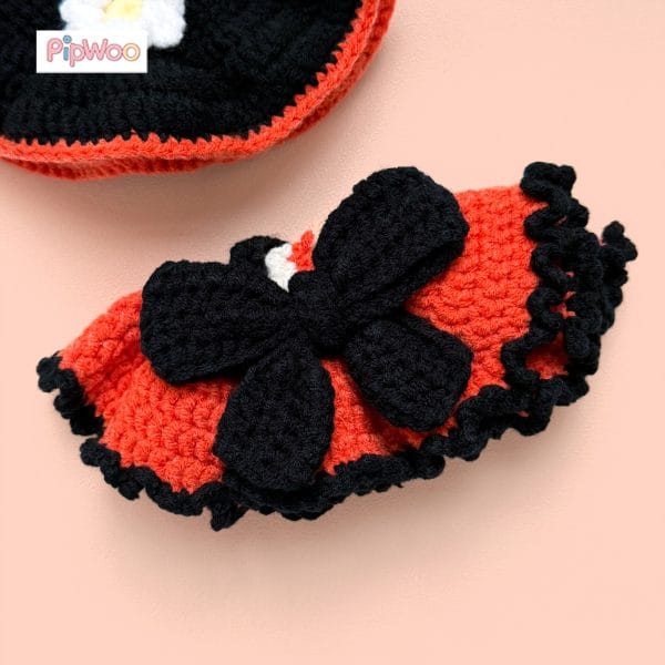 Close-up of Crochet Labubu Clothes – Halloween Witch featuring the central crochet bow and heart ornament on the skirt.