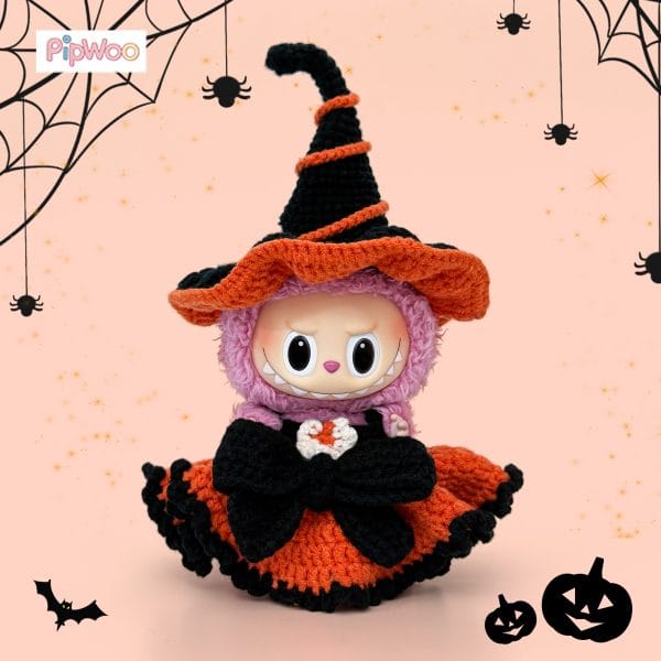 Front view of Crochet Labubu Clothes – Halloween Witch highlighting the decorative bow and heart crochet detail on the skirt and the plush yarn texture.